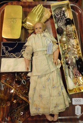 Lot 1000 - Late 19th Century Poured Wax Shoulder Head Doll with fixed blue eyes, blond wig, on a fabric...