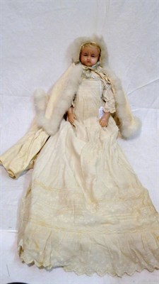 Lot 1001 - 19th Century Poured Wax Shoulder Head Doll with blond wig, sleeping blue eyes, on a fabric body...