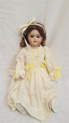 Lot 1015 - Schoenau And Hoffmeister Bisque Socket Head Doll impressed '1909', with original brown wig,...