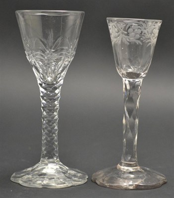 Lot 7 - A Wine Glass, circa 1780, the rounded funnel bowl engraved with a band of scrolling foliage on...