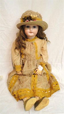 Lot 1024 - Simon And Halbig Bisque Socket Head Doll impressed 1079 with pierced ears, later wig, sleeping blue