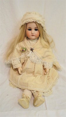 Lot 1025 - Kammer And Reinhardt Bisque Socket Head Child Doll with pierced ears, sleeping blue eyes, open...