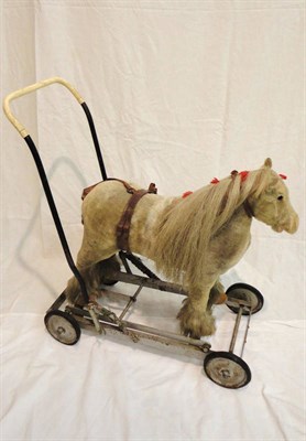 Lot 1027 - Panurge Pets Childs Push Along Horse bearing label 'Panurge Pat Double Action Movement', the...