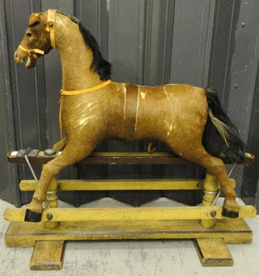 Lot 1028 - Late 19th Century Deer Skin Covered Small Rocking Horse with glass eyes, carved open mouth and...