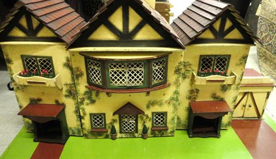 Lot 1031 - Circa 1938 Triple Gable Amersham Dolls House with a central break front wooden facade,  doors...