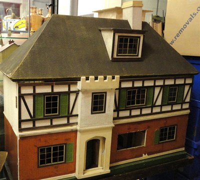 Lot 1035 - A Very Large Circa 1930's Dolls House Possibly By Tri-ang, with a part brick papered and...