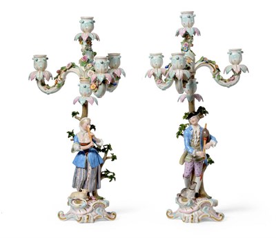 Lot 50 - A Pair of Meissen Porcelain Figural Candelabra, circa 1900, as a musical shepherd and...