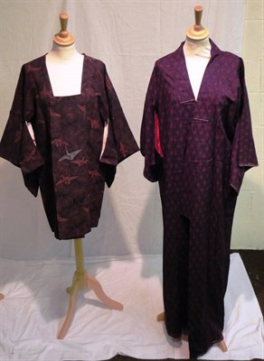 Lot 1109 - Late 19th Century Japanese Black Tomesode Robe with a brightly coloured design to the hem depicting