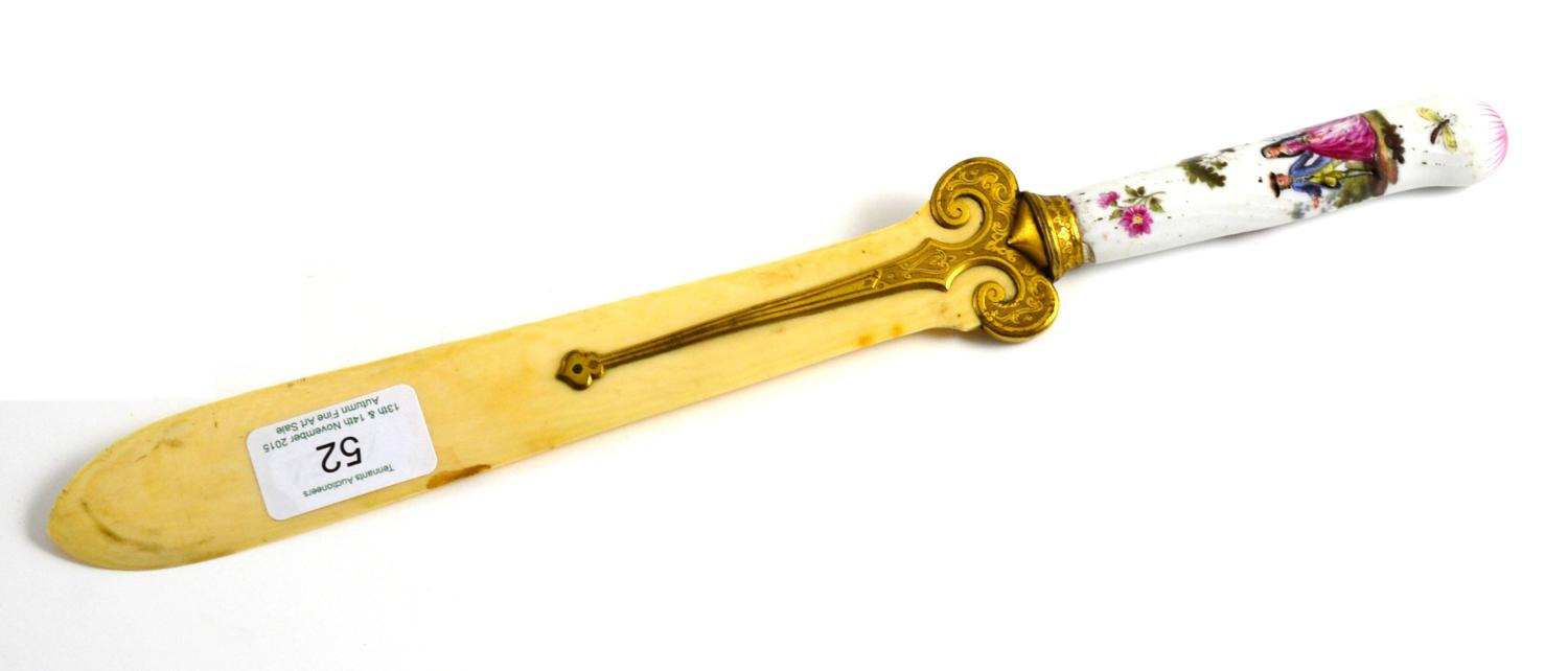 Lot 52 - A German Porcelain Knife Handle, 19th century, painted with 18th century lovers in landscape, later