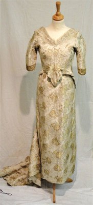 Lot 1114 - 19th Century Gold Brocade Two Piece, comprising a fitted bodice with lace mounts and gold trims...