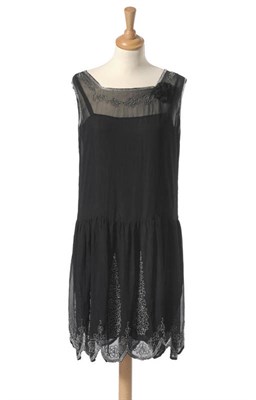 Lot 1117 - Circa 1920's Black Chiffon And Beaded Shift Dress with a drop waist, and beaded and scalloped hem.