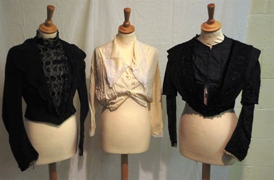 Lot 1118 - Four Late 19th Century Black Silk Bodices with various lace and other appliques; two cream silk...