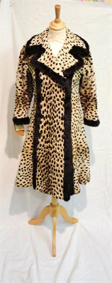 Lot 1119 - Circa 1960's Christian Dior Cheetah And Mink Trimmed Double Breasted Coat, with a lapel collar,...