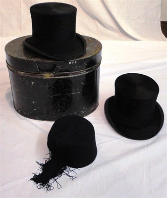 Lot 1148 - Christys & Co Black Silk Top Hat in a tin hat case, another by Dunn & Co in a card case and a black