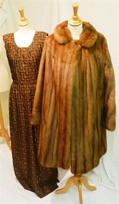 Lot 1164 - Hardy Amies Ready To Wear' Brown Self Patterned Full Length Evening Dress; fur coat, two fur...