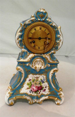 Lot 15 - Porcelain clock with brass dial painted in blue