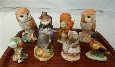 Lot 23 - Two Beswick owls, a blue tit, a pheasant and four Beatrix Potter figures
