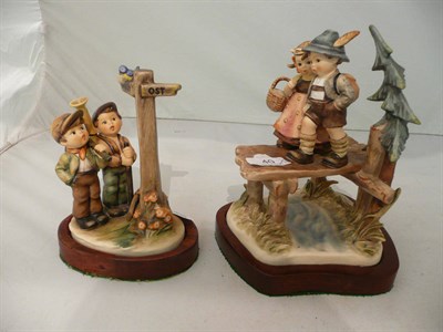 Lot 40 - Hummel figure group 'Crossroads' and another titled 'On Our Way' both on later stands