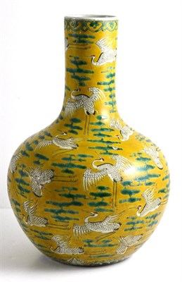 Lot 74 - A Chinese Porcelain Yellow Ground Bottle Vase, Kangxi reign mark but not of the period, painted...