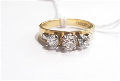 Lot 48 - An 18ct gold band ring set with three old cut diamonds