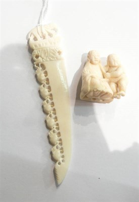 Lot 50 - An ivory netsuke and a carved bone elephant letter opener