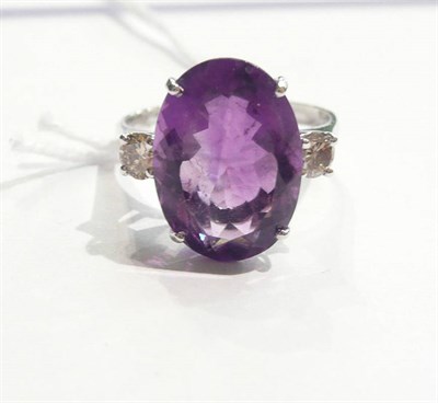 Lot 71 - A 14ct white gold amethyst and diamond three stone ring