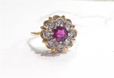 Lot 81 - An 18ct gold ruby and diamond cluster ring