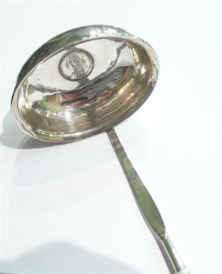 Lot 99 - A silver and balleen punch ladle with a George II coin inset