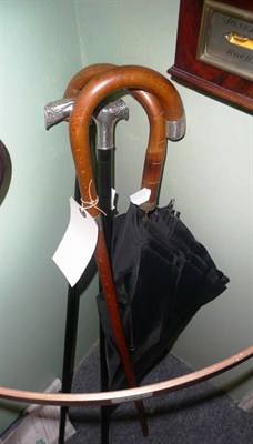 Lot 123 - Three walking sticks and an umbrella (4)