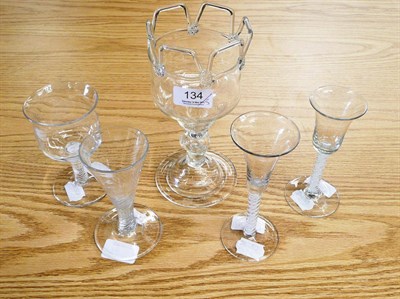 Lot 134 - Two 18th century Continental cotton twist wine glasses and a decorated baluster stemmed...