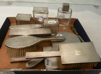 Lot 140 - A 1920's silver dressing table set with engine-turned decoration and another