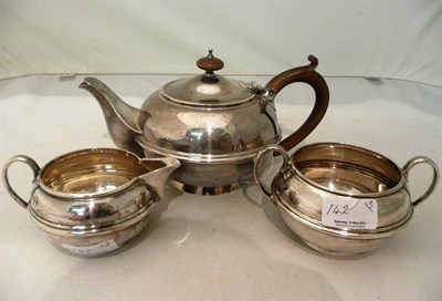 Lot 142 - A silver three piece tea service