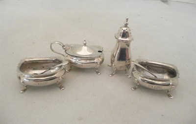 Lot 152 - Silver four piece cruet with silver spoons