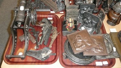 Lot 174 - Two trays including ornamental guns, book ends, plaques etc