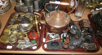 Lot 179 - Three trays of assorted metal money boxes, oil cans, copper kettle, and a box of money boxes in the