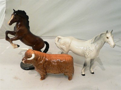 Lot 183 - Beswick Highland cattle, a Beswick grey horse and a Beswick rearing horse (3)