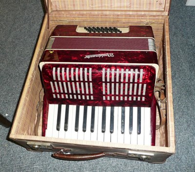 Lot 195 - A cased Woldmaster piano accordion