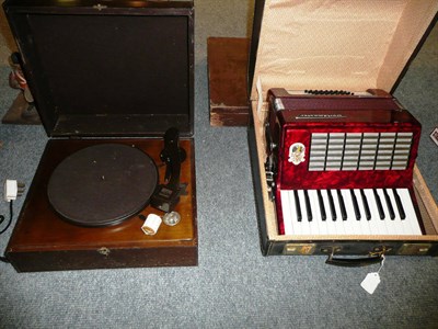 Lot 198 - A cased piano accordion and an HMV record player (2)