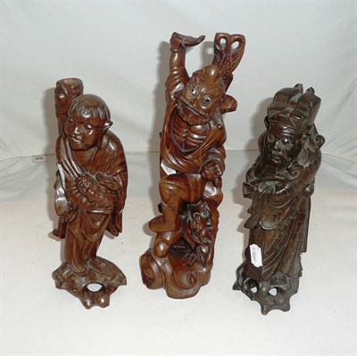 Lot 265 - Three Chinese carved hardwood Daorst figures