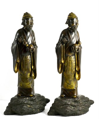 Lot 118 - A Pair of Chinese Parcel Gilt Bronze Figures of Scholars, Qing Dynasty, probably 18th century,...