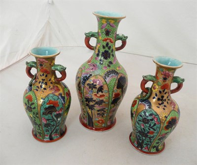 Lot 271 - Three oriental vases with over painted decoration