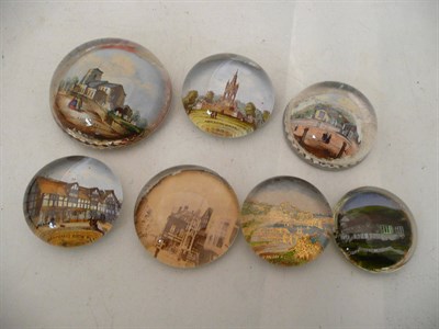 Lot 275 - Seven reverse printed glass paperweights