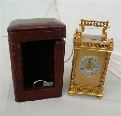 Lot 277 - A striking brass carriage clock with fitted travelling case