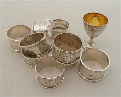 Lot 290 - A quantity of silver napkin rings, and a Victorian egg cup, approx 9oz