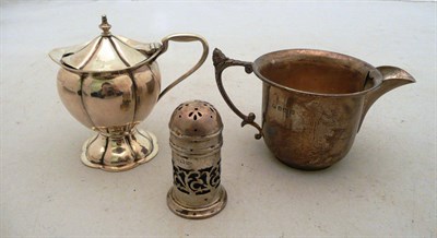 Lot 291 - A silver mustard pot, a silver jug and a silver pepper pot