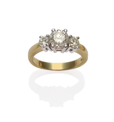 Lot 272 - A Diamond Three Stone Ring, the brilliant cut diamonds in white four claw settings, to a yellow...