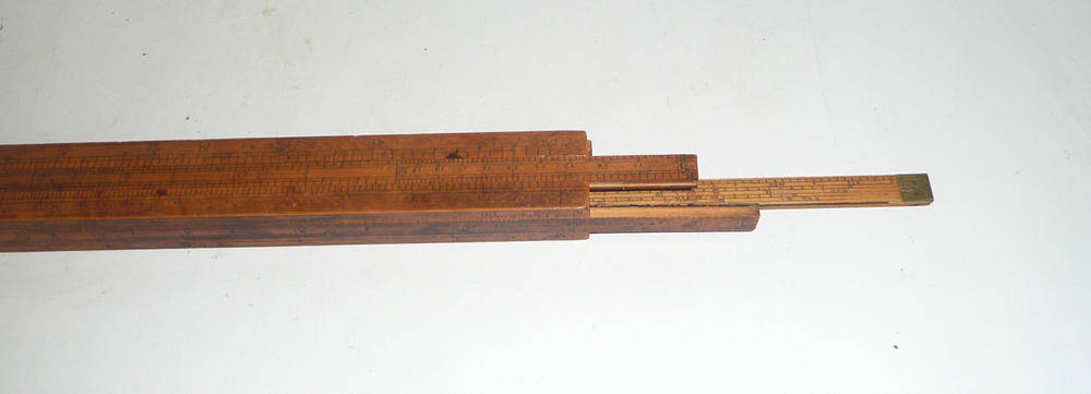 Lot 1047 - A 19th Century Excise Gaugers 12inch Boxwood Slide Rule by Cook, London, stamped 'Cook Maker to The