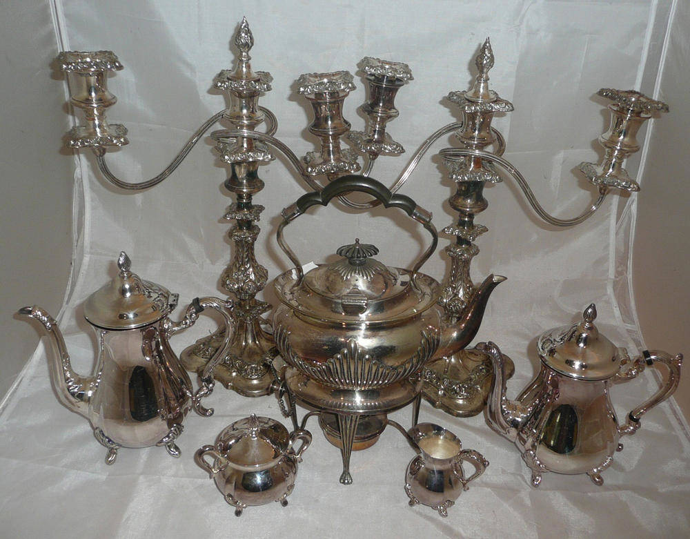 Lot 9 - Pair of plated candelabrum, kettle on stand and a four piece tea service