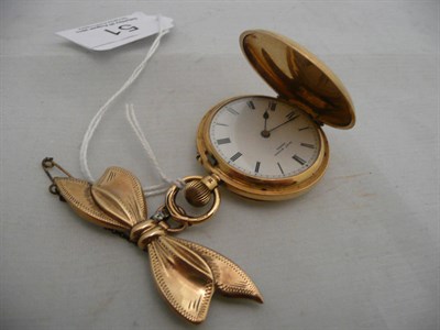 Lot 51 - An 18ct gold pocket watch with bow brooch