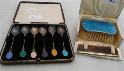 Lot 56 - A cased set of enameled and silver coffee spoons and a similar brush and comb